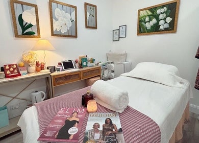 Relaxing treatment room at Mina Beauty & Massage, Mermaid Beach, Queensland, AU, featuring elegant decor.