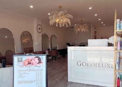 Chic interior of Mina Beauty & Massage in Mermaid Beach, Queensland, AU with elegant mirrors and chandeliers.