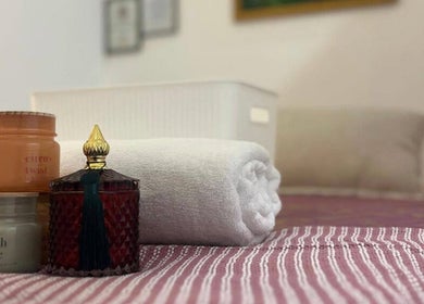 Candles and towels create a calming vibe at Mina Beauty & Massage, Mermaid Beach, Queensland, AU.