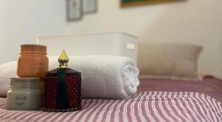 Candles and towels create a calming vibe at Mina Beauty & Massage, Mermaid Beach, Queensland, AU.