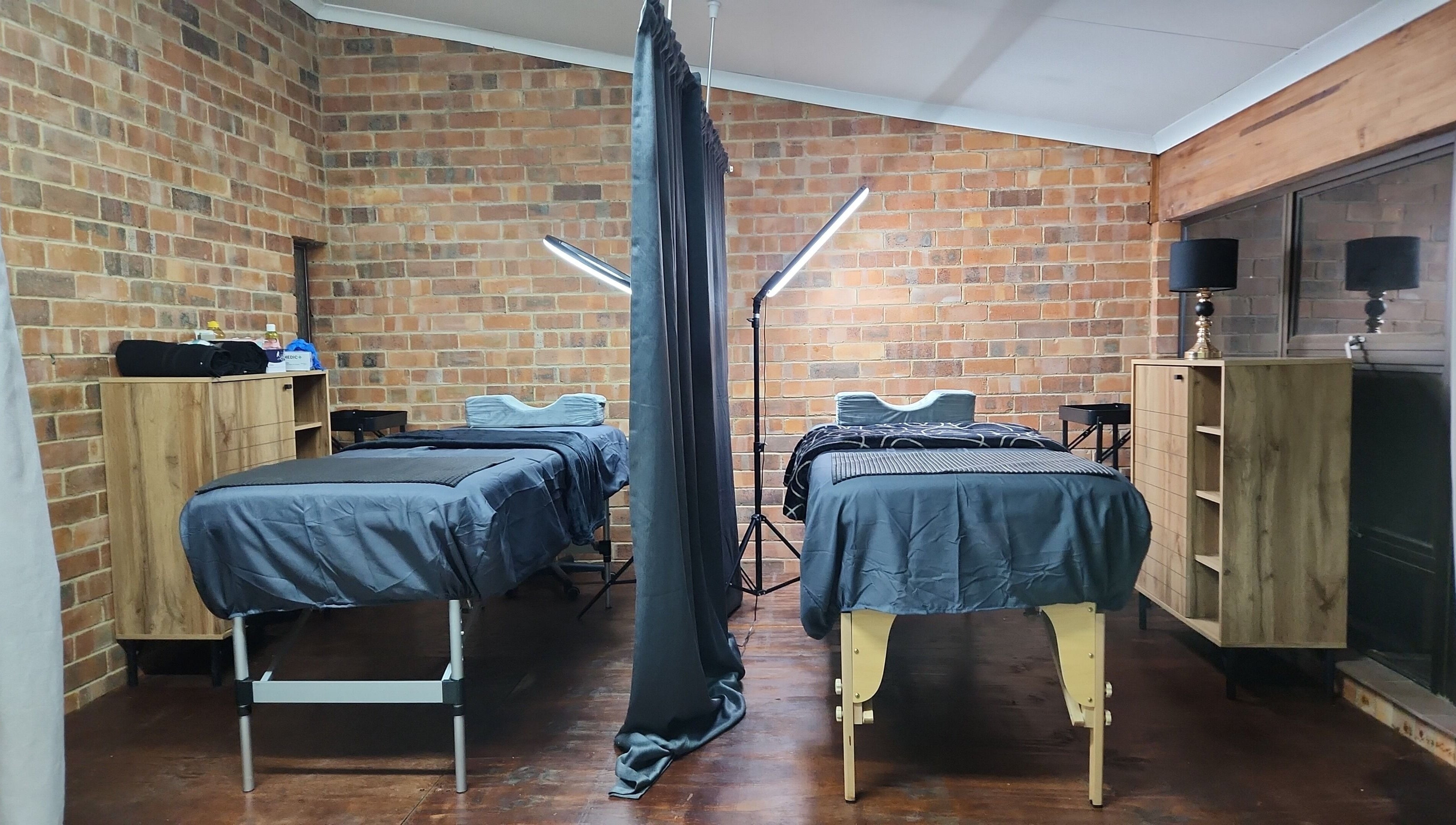 Cozy dual treatment room at M's Aesthetics in Krugersdorp, Gauteng, ZA, offering a tranquil ambiance.