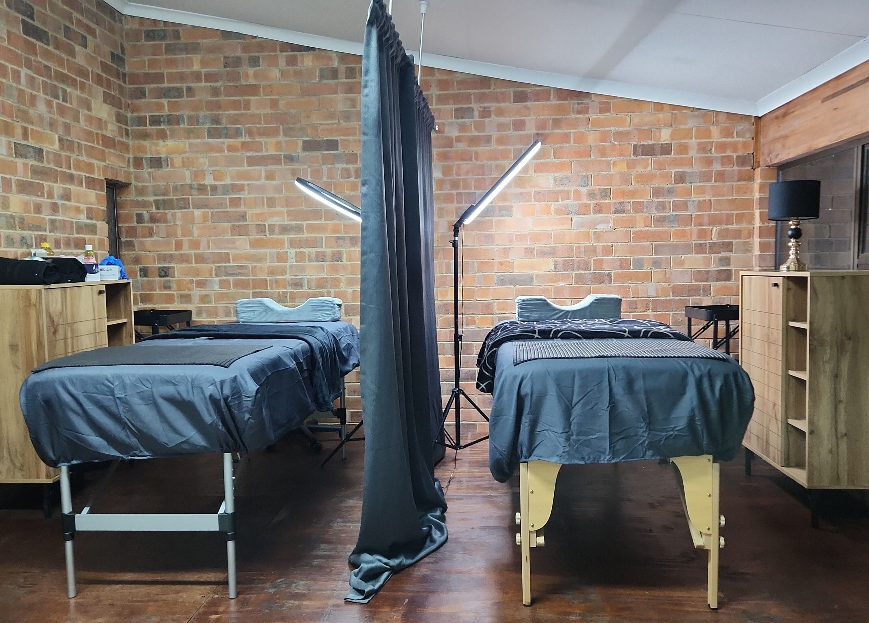 Cozy dual treatment room at M's Aesthetics in Krugersdorp, Gauteng, ZA, offering a tranquil ambiance.