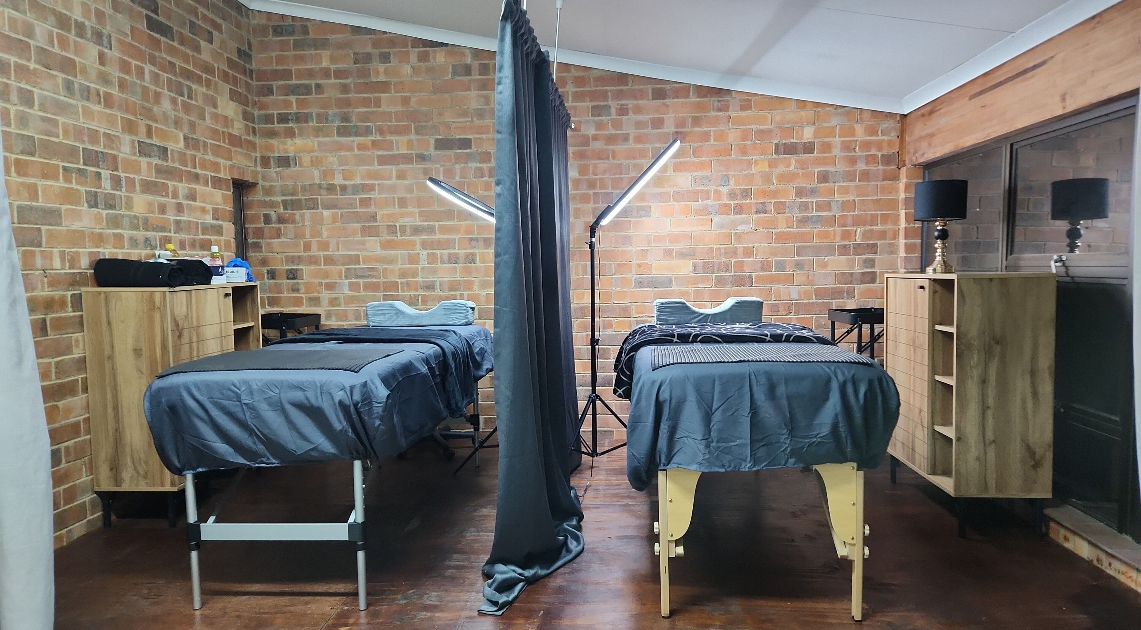 Cozy dual treatment room at M's Aesthetics in Krugersdorp, Gauteng, ZA, offering a tranquil ambiance.