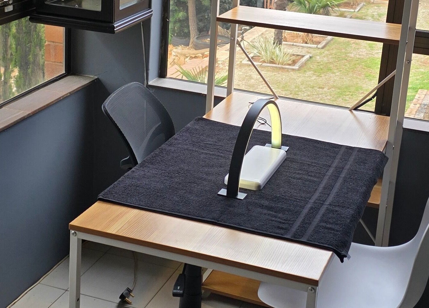 Cozy workspace at M's Aesthetics, Krugersdorp, Gauteng, ZA with garden view and modern furnishings.