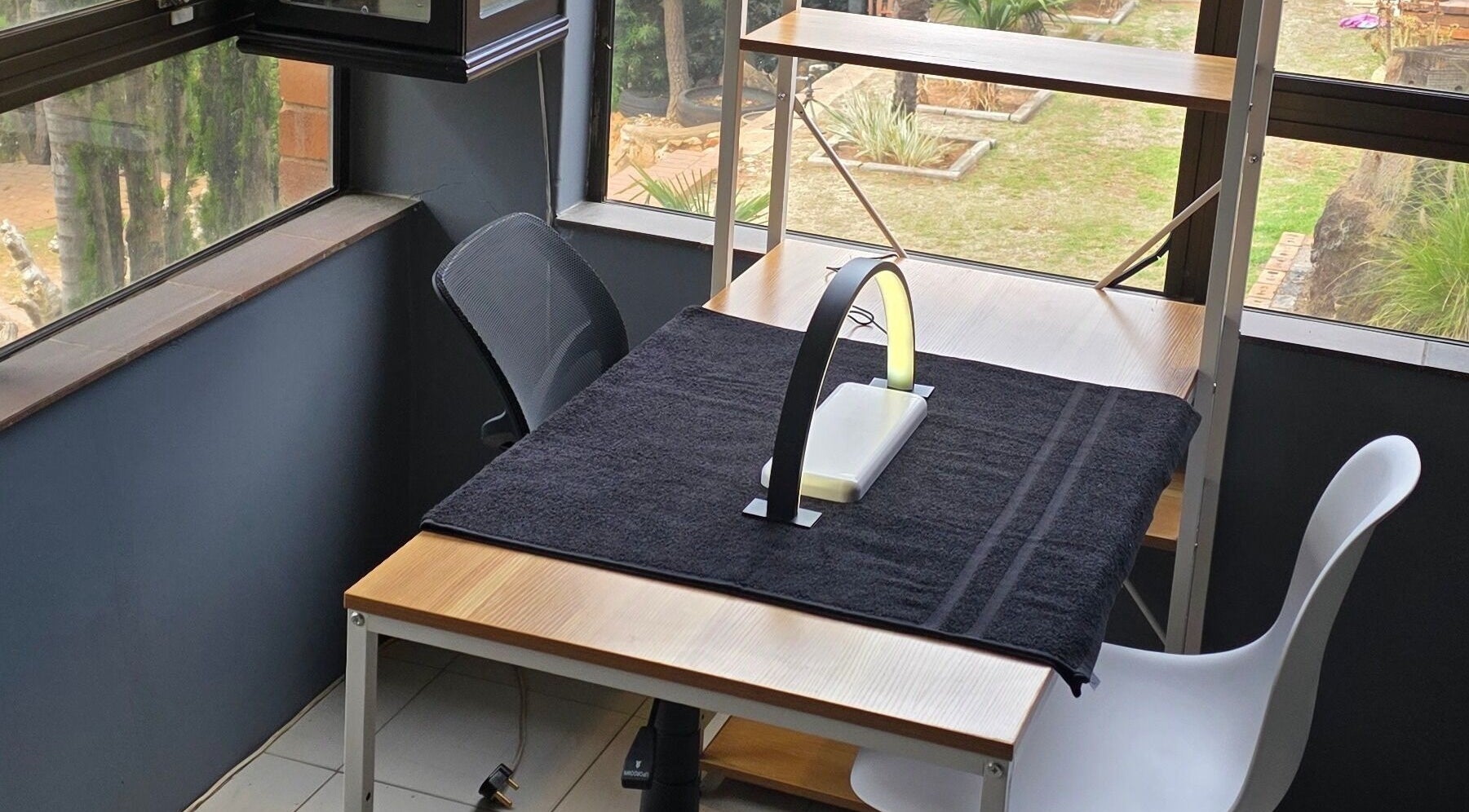 Cozy workspace at M's Aesthetics, Krugersdorp, Gauteng, ZA with garden view and modern furnishings.