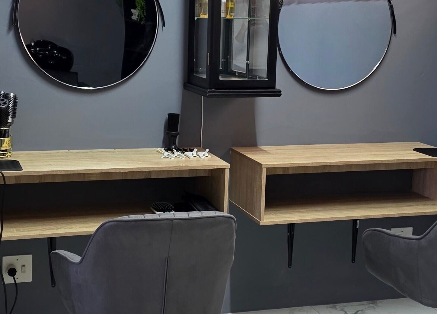 Chic styling station at M's Aesthetics, Krugersdorp, Gauteng, ZA with modern mirrors and grooming tools.