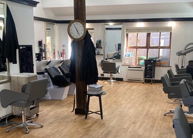 Stylish salon seating at Emma Dixon Hair, Bury St Edmunds, England, GB. Spacious layout with modern design.