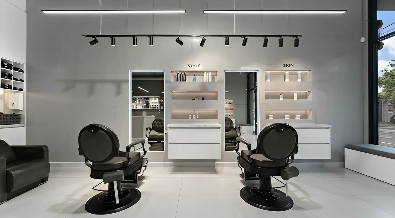 Modern interior of M.Y Barber House in Melbourne, Victoria, AU showcasing sleek chairs and elegant design.