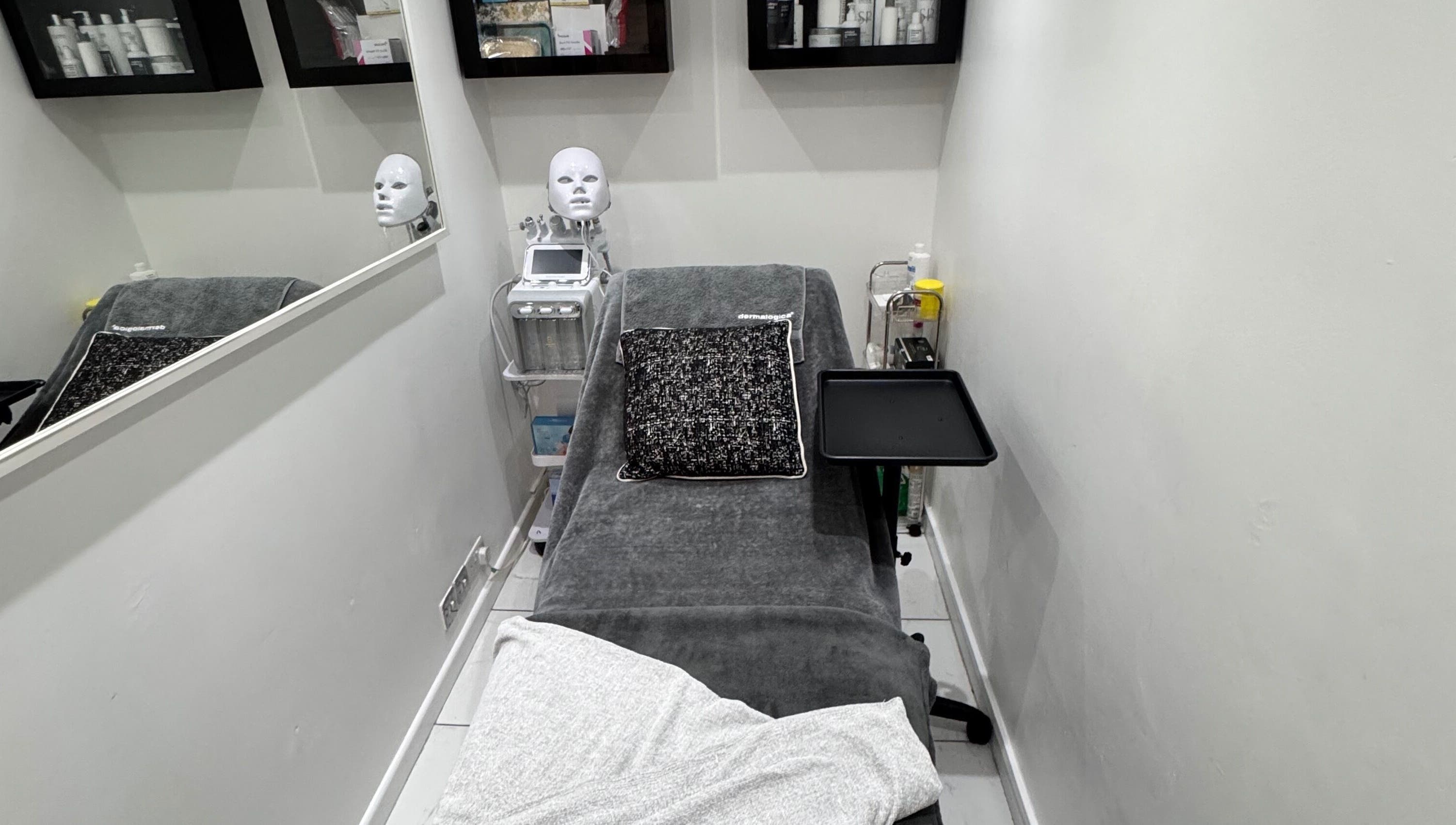 Therapy room at EnhancedwithKay, London, England, GB, featuring treatment bed and equipment.