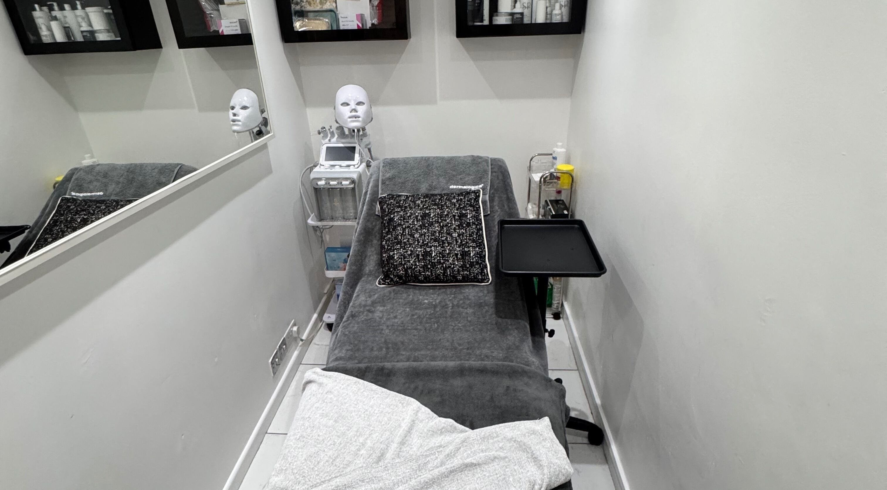 Therapy room at EnhancedwithKay, London, England, GB, featuring treatment bed and equipment.