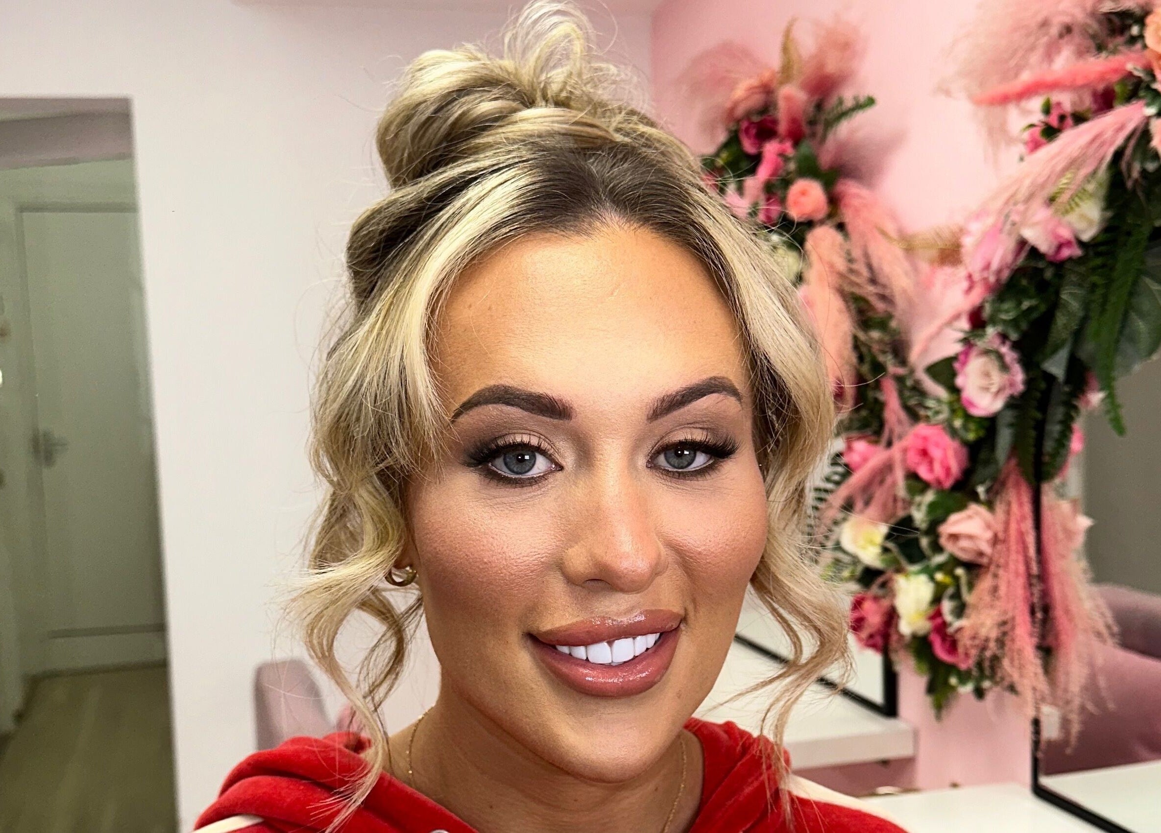 Elegant makeup look at Alex Lajbrok Makeup with lush floral decor in Middlesbrough, England, GB.