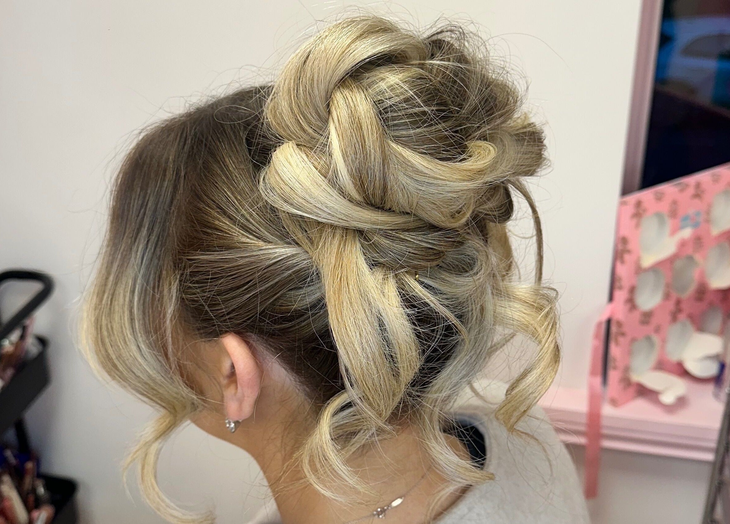 Elegant hairstyle by Alex Lajbrok Makeup, Middlesbrough, England, GB with blonde curls styled in an updo.