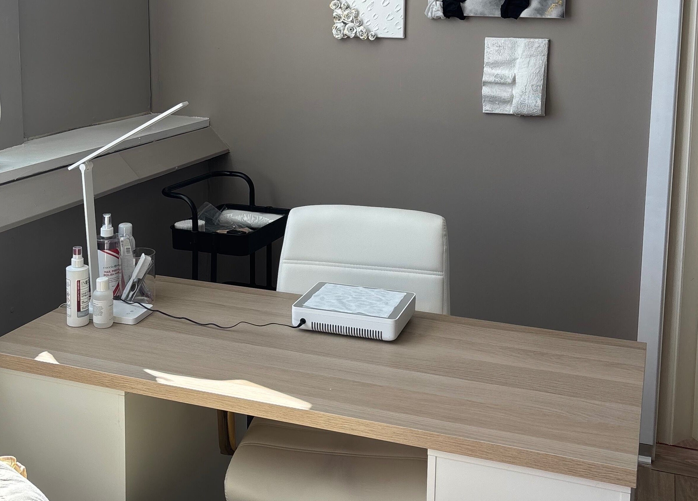 Elegant workspace at Carved by Chloe in Livingston, Scotland, showcasing a modern, minimalist design.