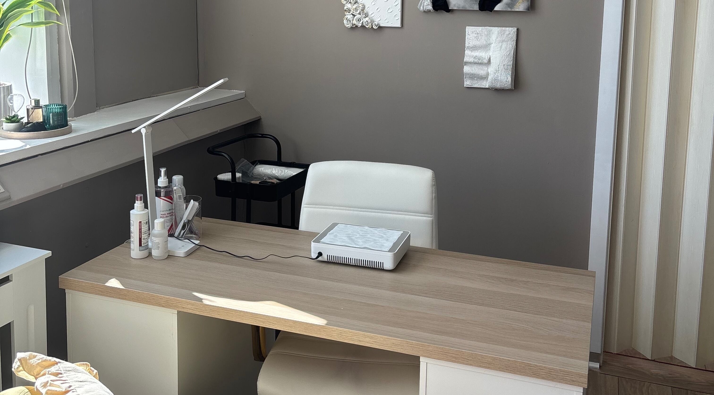 Elegant workspace at Carved by Chloe in Livingston, Scotland, showcasing a modern, minimalist design.