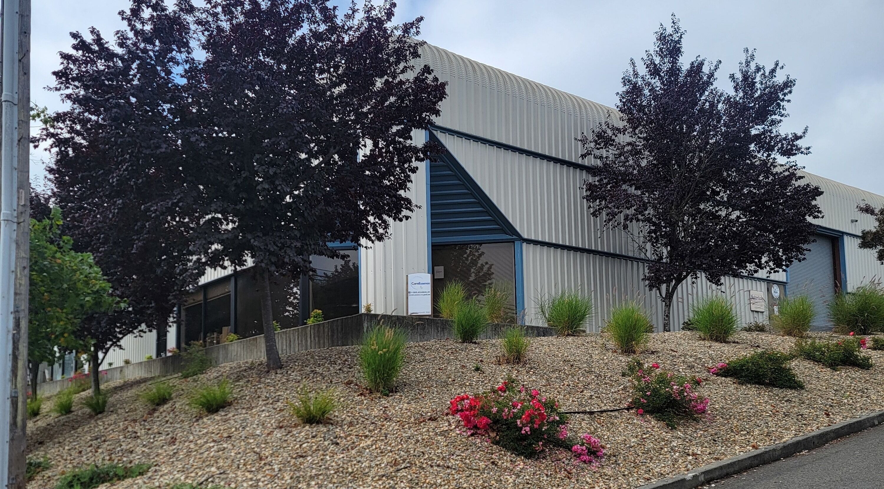 Core Essence building with landscaped greenery in Sebastopol, California, US showcasing beauty and wellness.