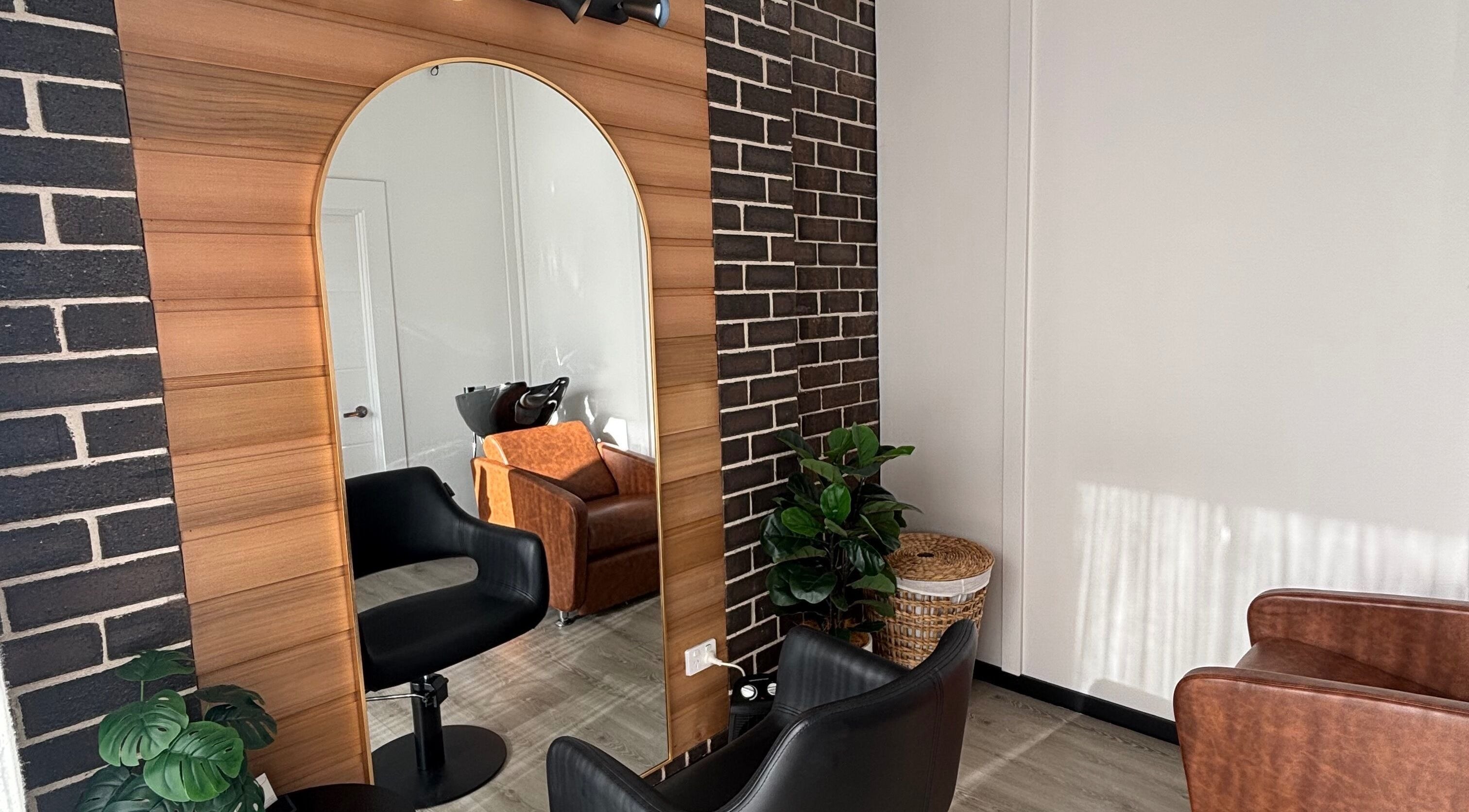 Modern salon chair and mirror at Hair By Char, Spring Farm, New South Wales, AU.