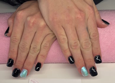 Elegant black and blue nails at Nails By Corrina, Lethbridge Park, New South Wales, AU on a pink cushion.