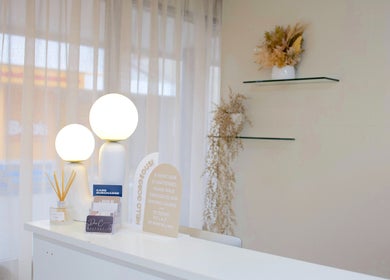 Elegant reception at Fleek Aesthetics, Mount Pleasant, Queensland, AU, featuring modern decor and warm lighting.