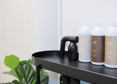 Fleek Aesthetics in Mount Pleasant, Queensland, AU features a sleek shelf with beauty products displayed.