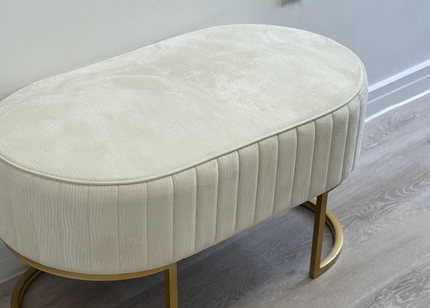 Elegant cream bench at Perfect Profile Aesthetics in Middleton, England, GB enhancing the serene ambiance.