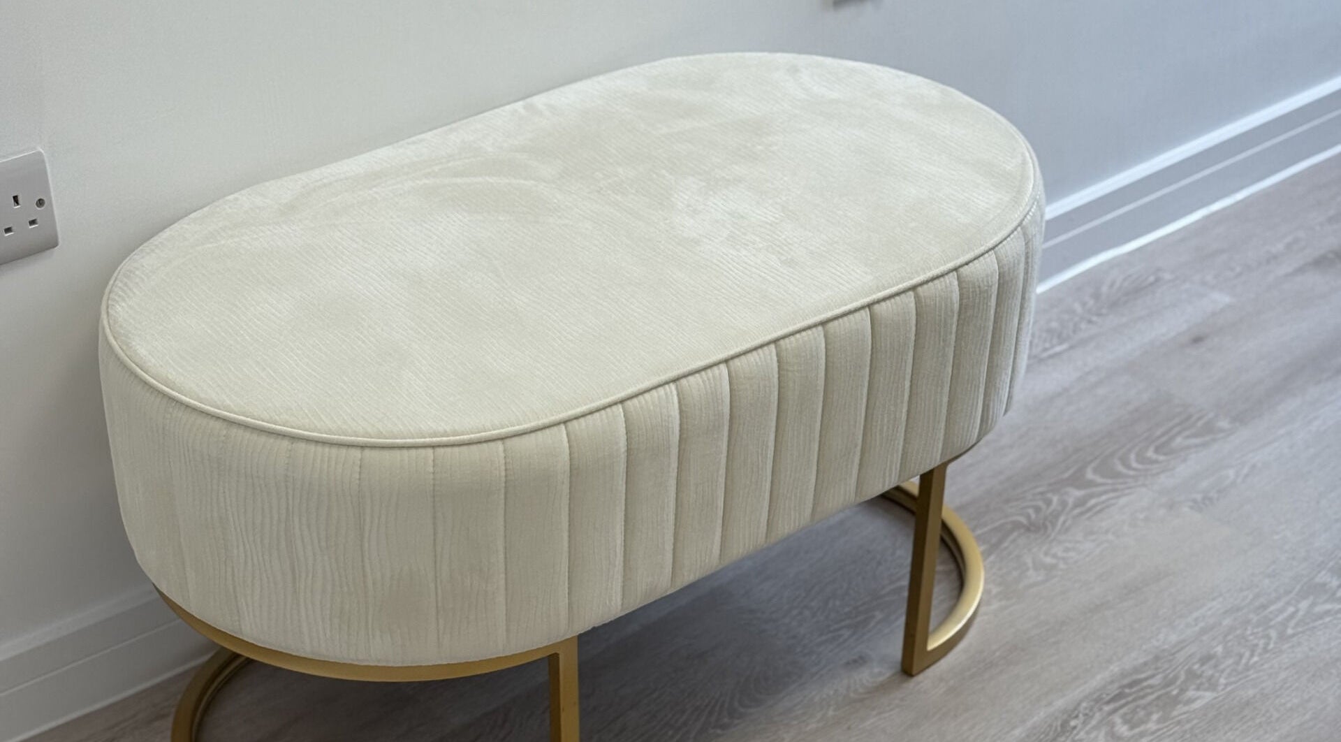 Elegant cream bench at Perfect Profile Aesthetics in Middleton, England, GB enhancing the serene ambiance.