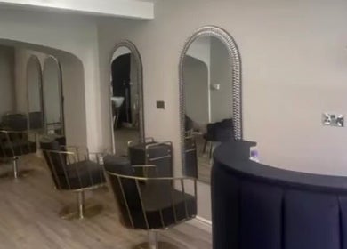 Chic interior of Charlotte Olivia Hair with stylish chairs and mirrors in Goole, England, GB.