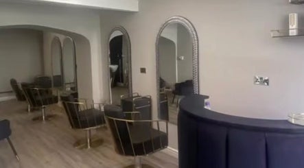 Chic interior of Charlotte Olivia Hair with stylish chairs and mirrors in Goole, England, GB.