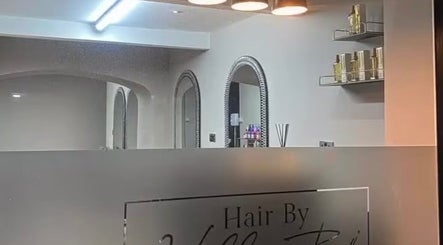 Entrance of Charlotte Olivia Hair in Goole, England featuring modern decor and elegant mirrors.