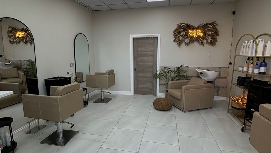 Modern salon interior at Hairbyaliceemma, Derby, England, GB, featuring stylish chairs and sleek decor.