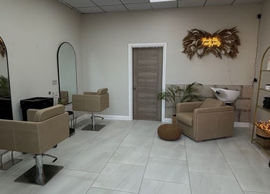 Modern salon interior at Hairbyaliceemma, Derby, England, GB, featuring stylish chairs and sleek decor.