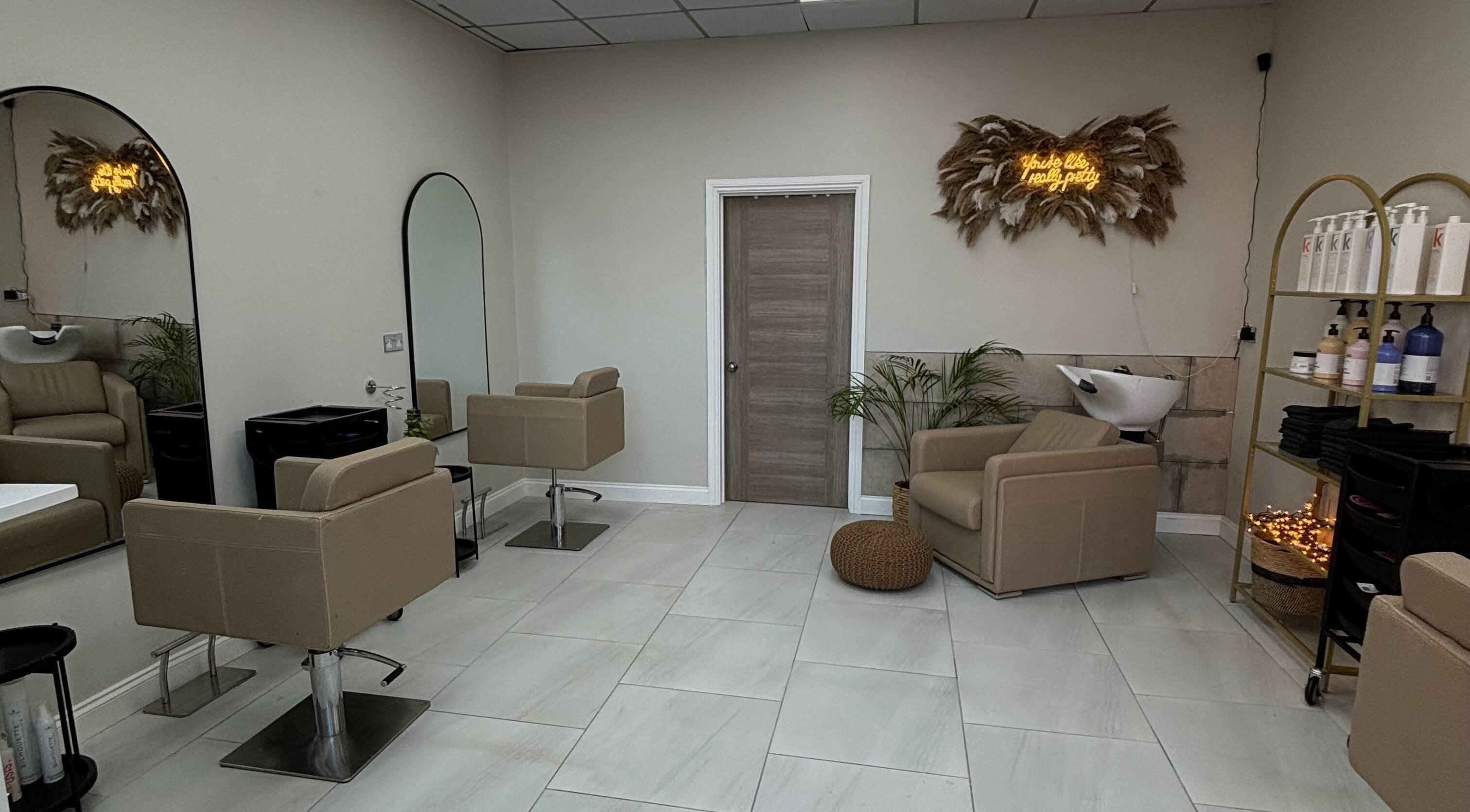 Modern salon interior at Hairbyaliceemma, Derby, England, GB, featuring stylish chairs and sleek decor.