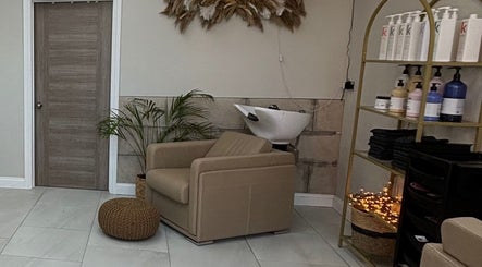Relaxing salon chair setup at Hairbyaliceemma, Derby, England, GB, with stylish decor and hair products.