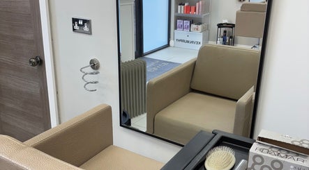 Modern salon chair and mirror at Hairbyaliceemma, Derby, England, GB offering stylish hair services.
