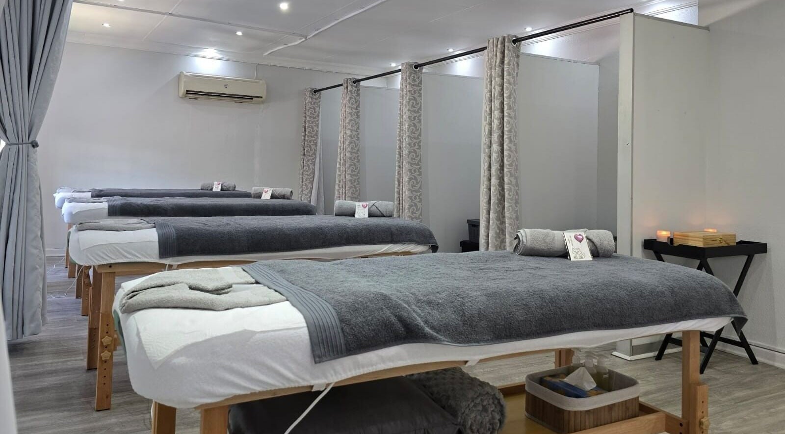 Tranquil massage room at Zenglow Wellness Boutique Spa, Pretoria, Gauteng, ZA with lined massage beds.