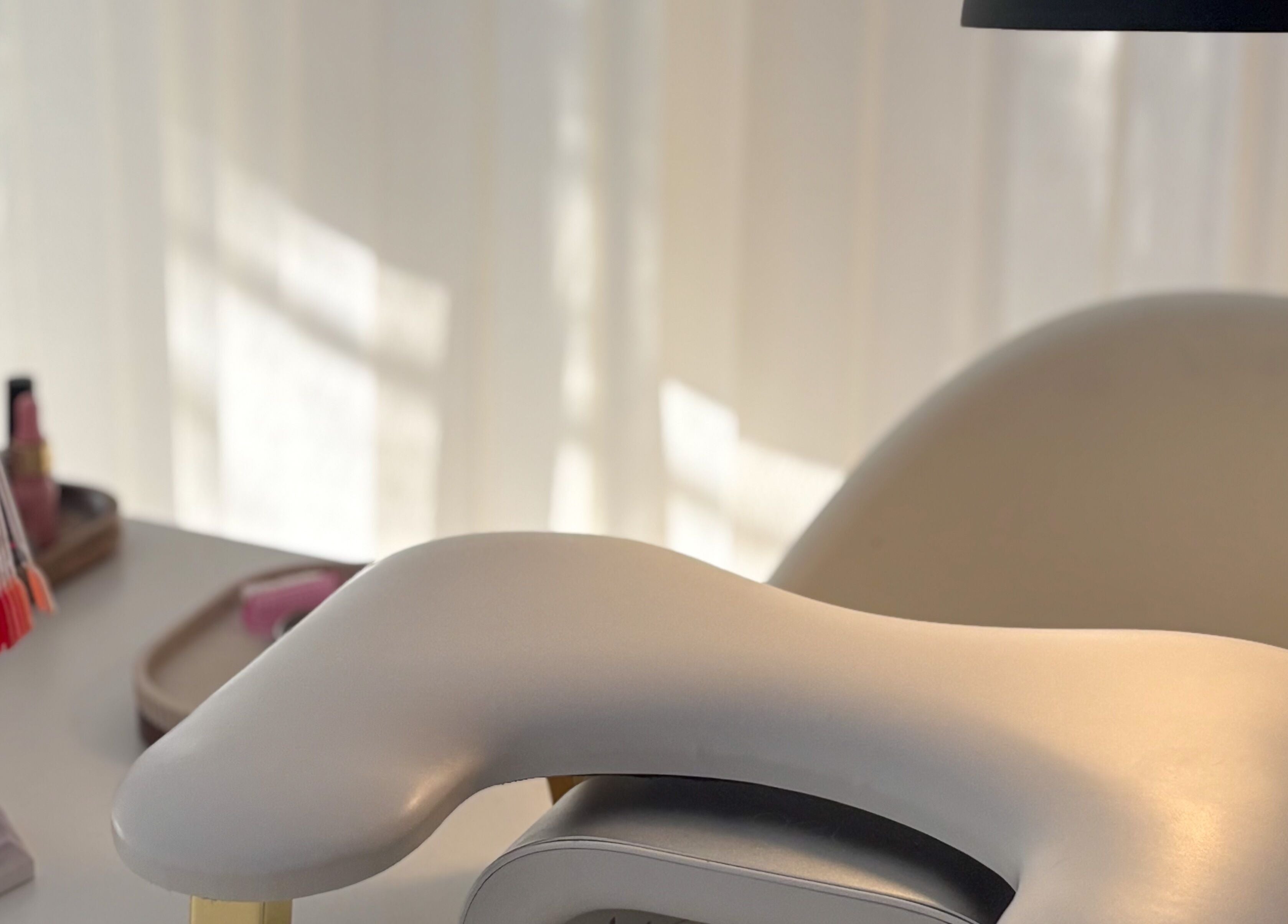 Elegant manicure station at Gels by Meg in Welshpool, Wales, GB with nail polish samples and comfy chair.