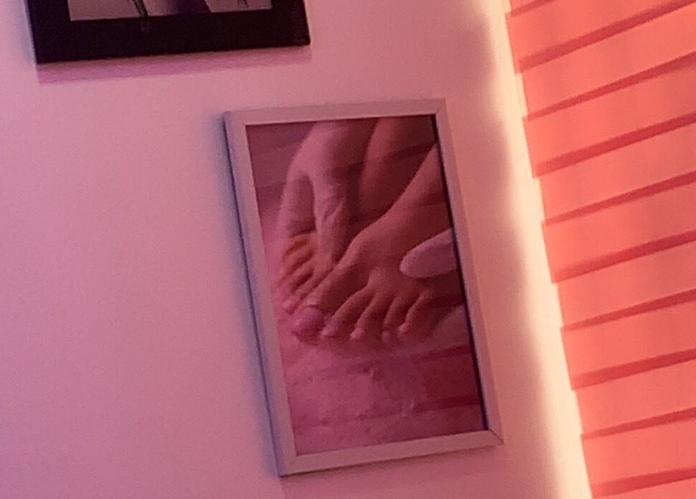 Framed photo of a pedicure at Nailed by Mokz, Lekki, Lagos, NG, showcasing serene pink interior.