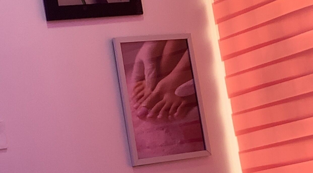 Framed photo of a pedicure at Nailed by Mokz, Lekki, Lagos, NG, showcasing serene pink interior.
