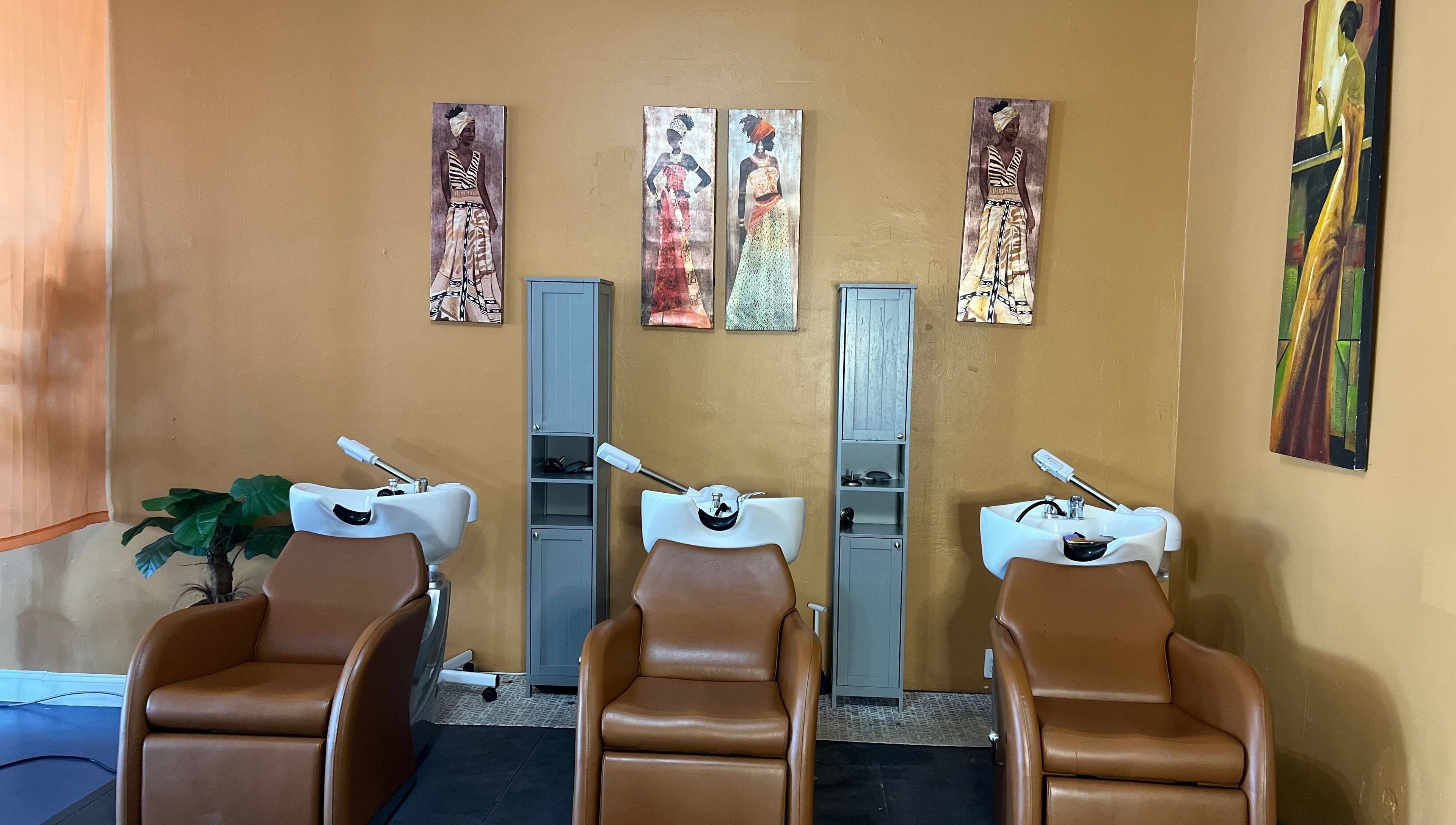 Elegant hair wash stations at Orlando Lox Bar, Orlando, Florida, US featuring stylish decor and comfy chairs.