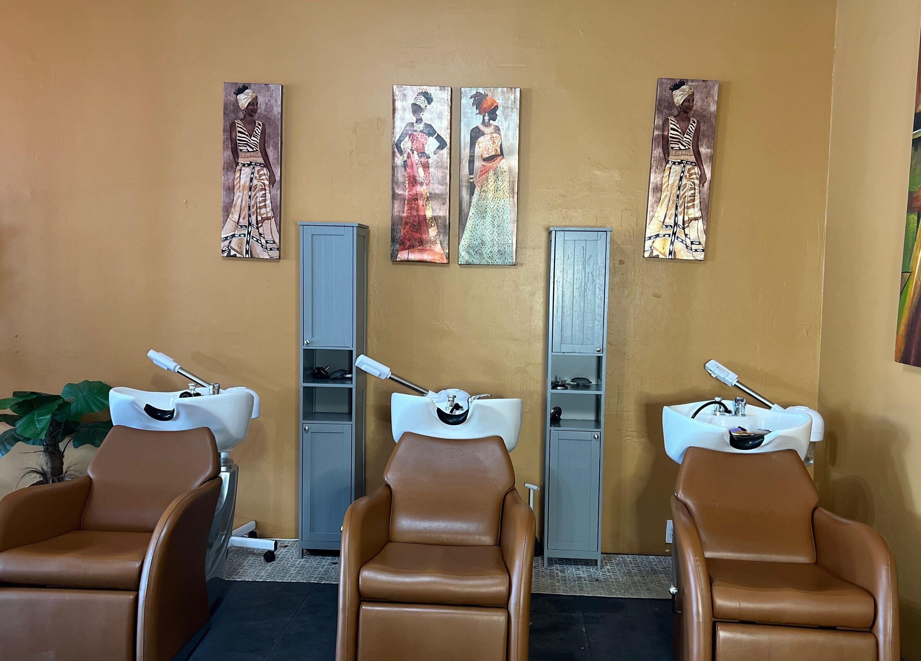 Elegant hair wash stations at Orlando Lox Bar, Orlando, Florida, US featuring stylish decor and comfy chairs.
