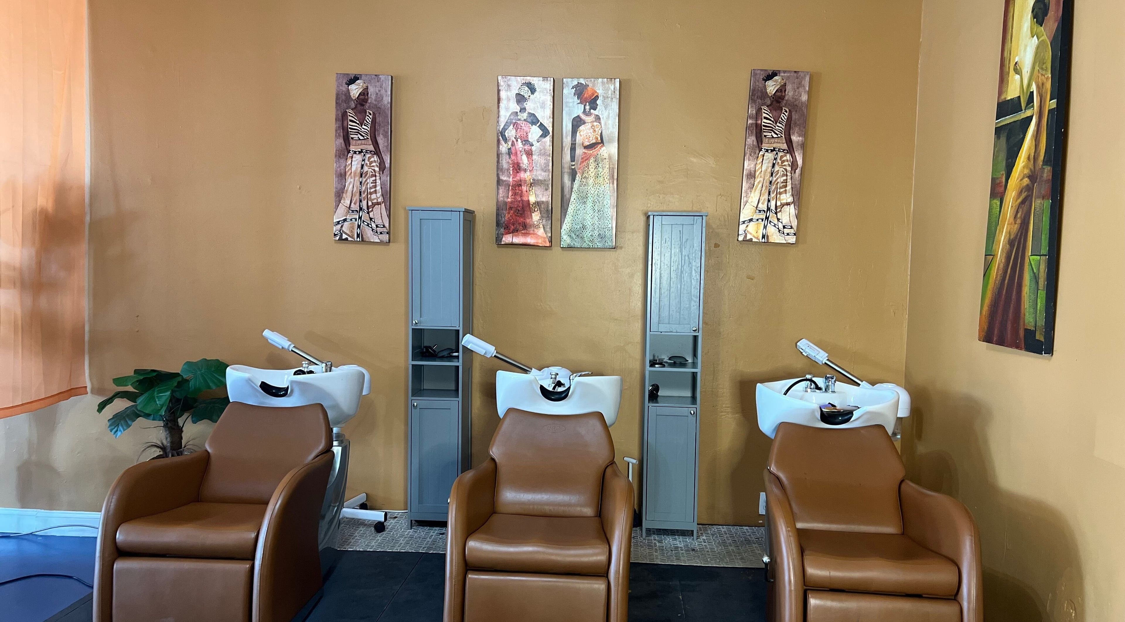 Elegant hair wash stations at Orlando Lox Bar, Orlando, Florida, US featuring stylish decor and comfy chairs.