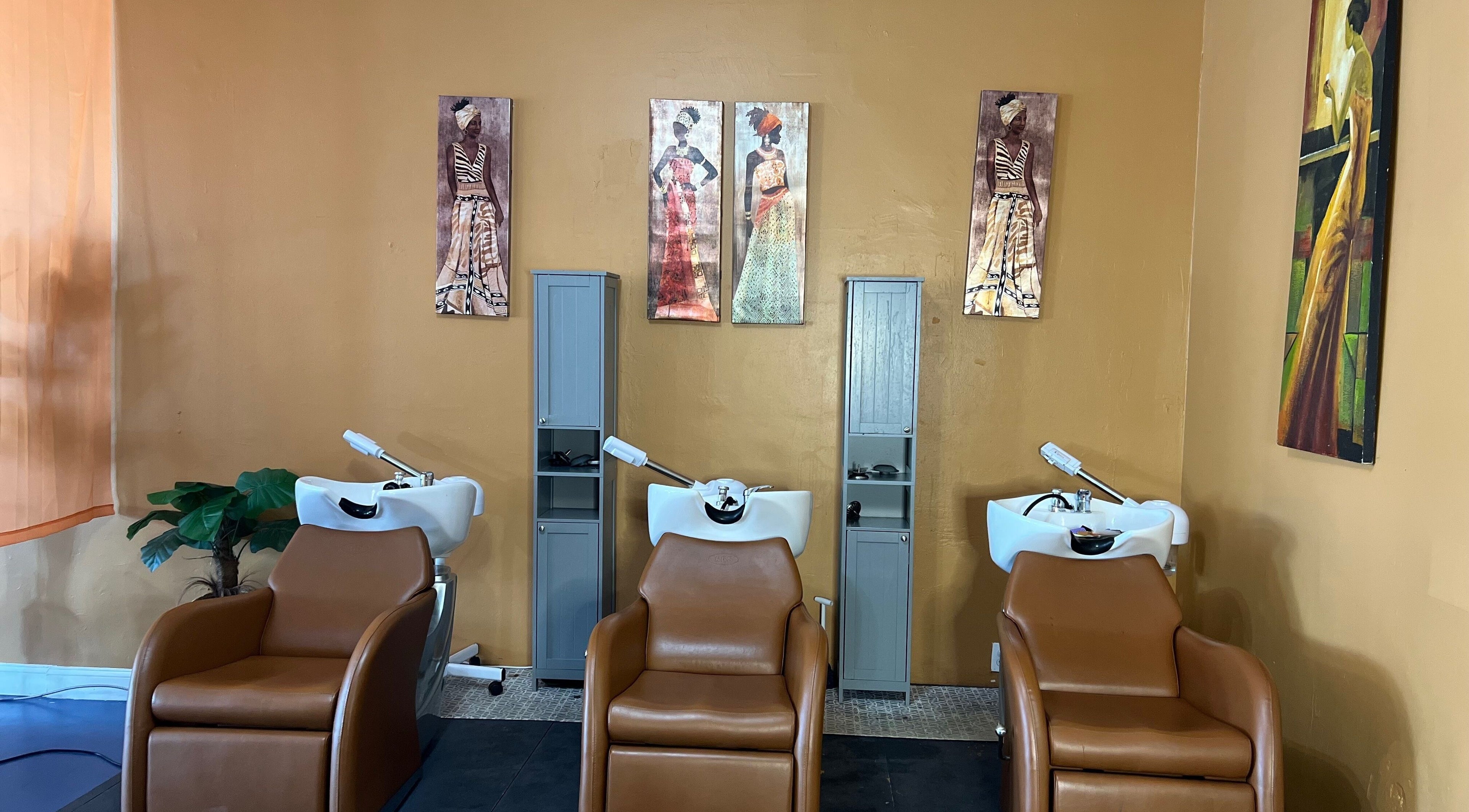 Elegant hair wash stations at Orlando Lox Bar, Orlando, Florida, US featuring stylish decor and comfy chairs.