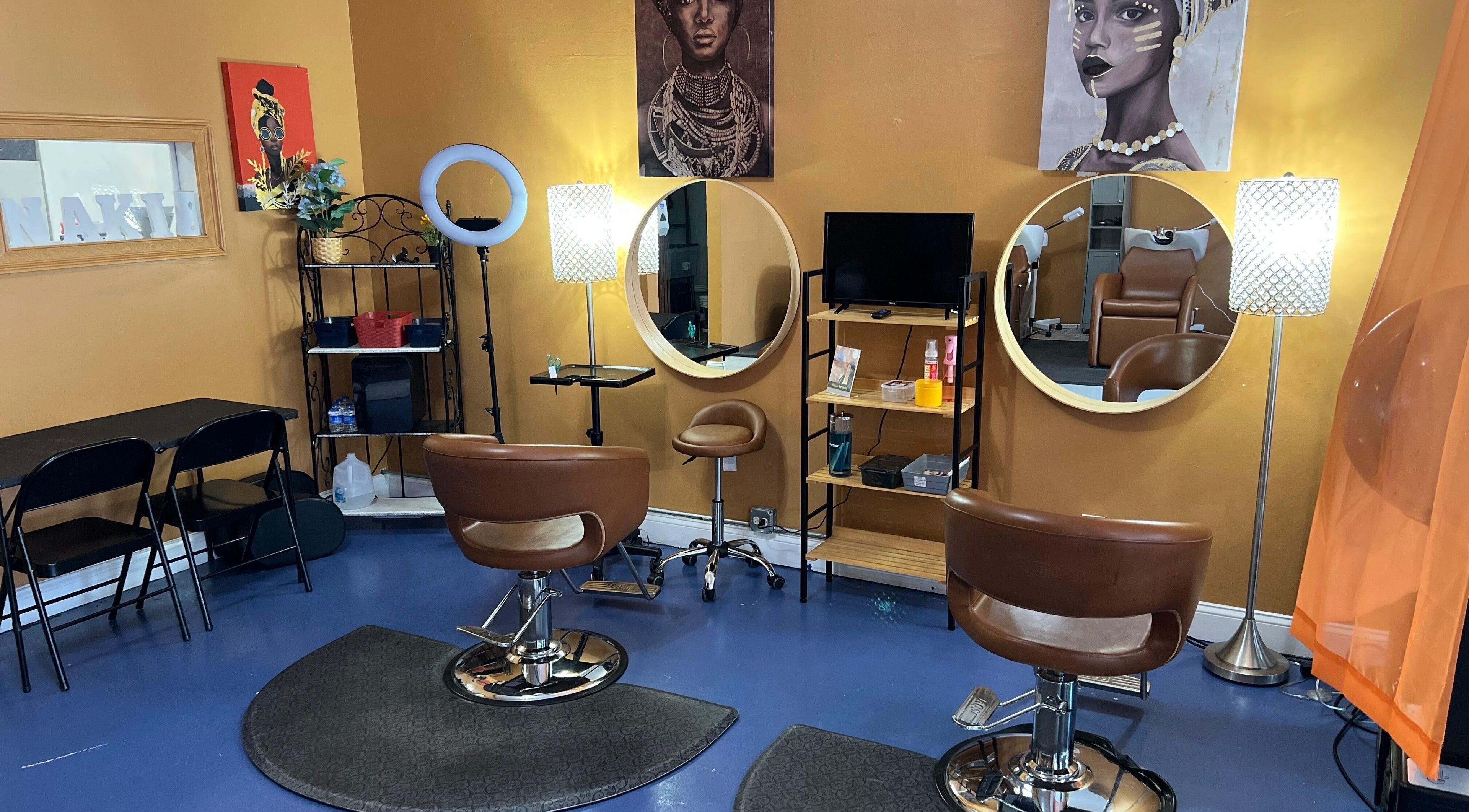 Stylish interior of Orlando Lox Bar in Orlando, Florida, US, featuring elegant salon chairs and artistic decor.