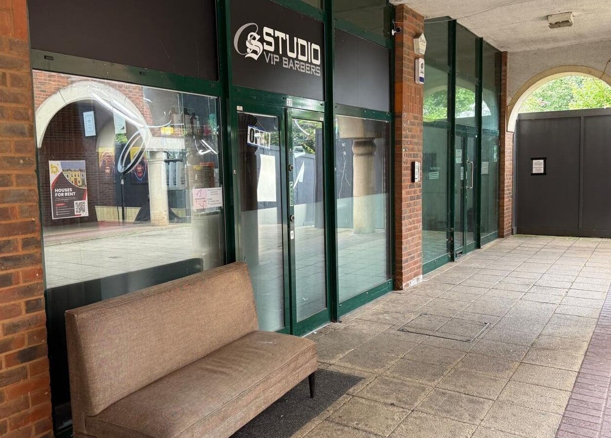 Front entrance of Cs Studio Vip Barbers in London, England, GB with stylish glass doors and inviting seating.