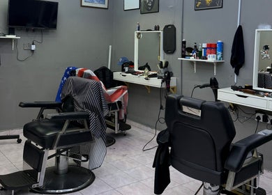 Street Crew Barbershop interior features sleek chairs and grooming tools in Kuala Lumpur, Wilayah Persekutuan Kuala Lumpur, MY.