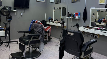 Street Crew Barbershop interior features sleek chairs and grooming tools in Kuala Lumpur, Wilayah Persekutuan Kuala Lumpur, MY.