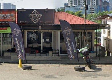 Street Crew Barbershop entrance in Kuala Lumpur, Wilayah Persekutuan Kuala Lumpur, MY, with signs and decor.