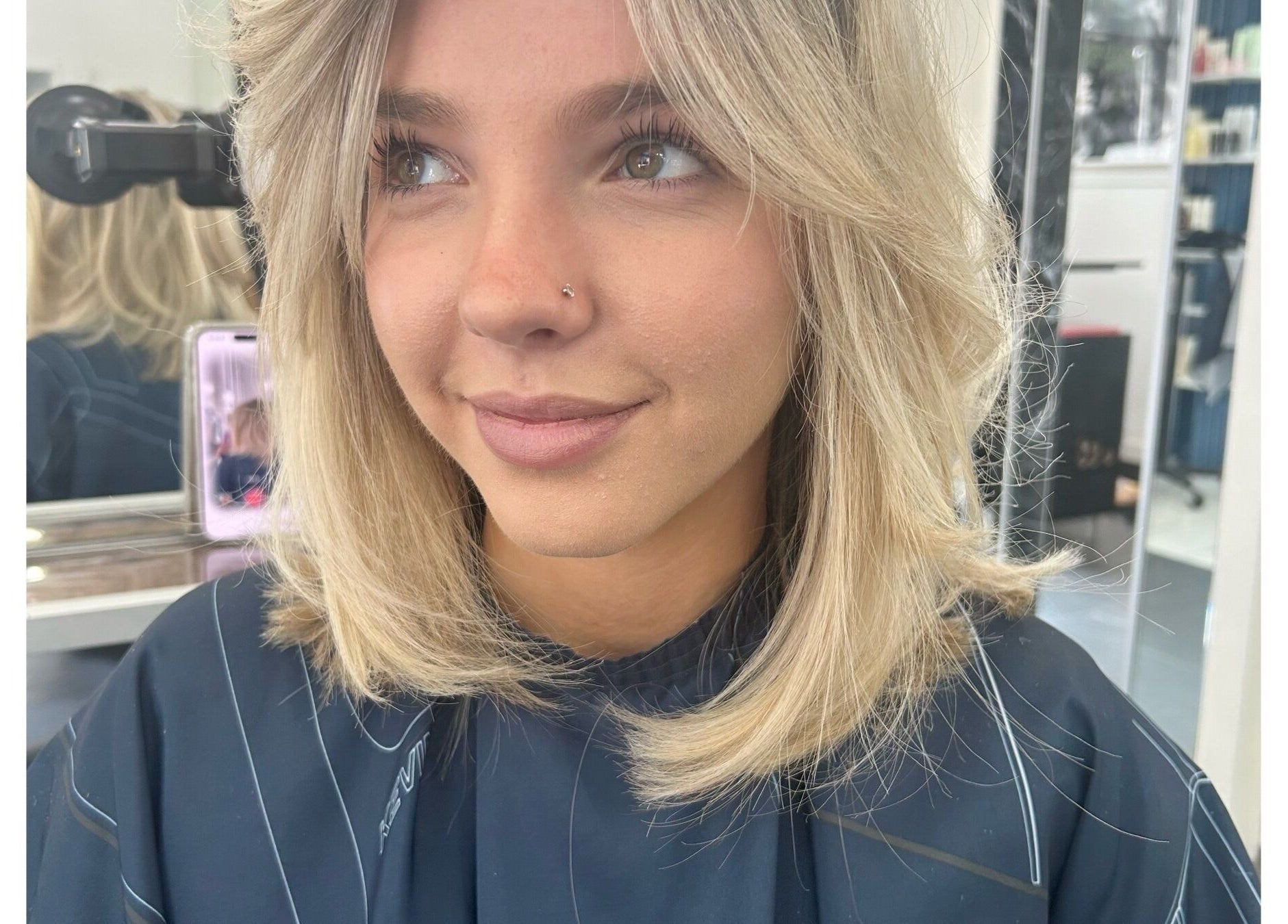Close-up of a woman with blonde hair styled at Sheena McCart, Vancouver, British Columbia, CA.
