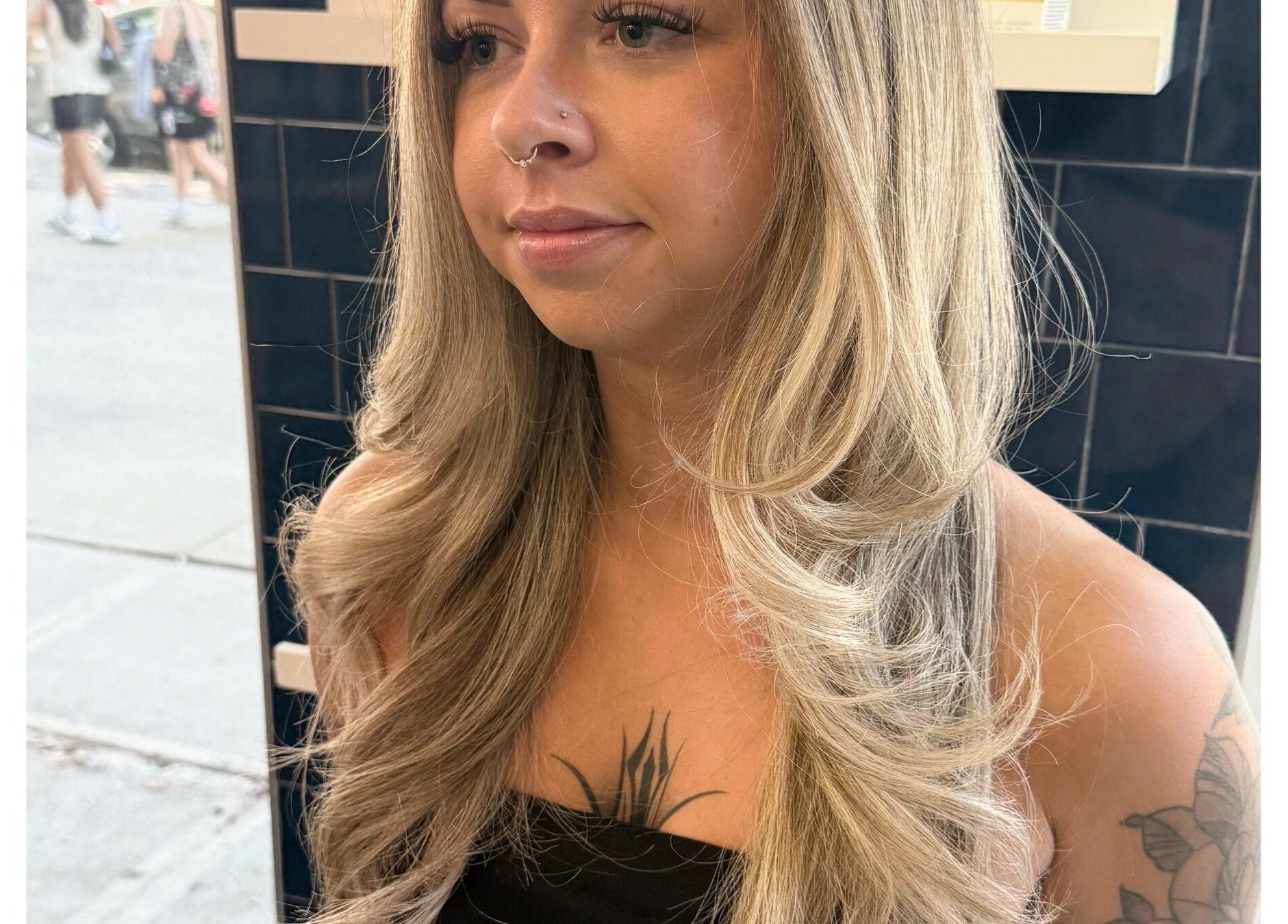 Close-up of blonde curls styled at Sheena McCart, Vancouver, British Columbia, CA, showcasing hair salon beauty.