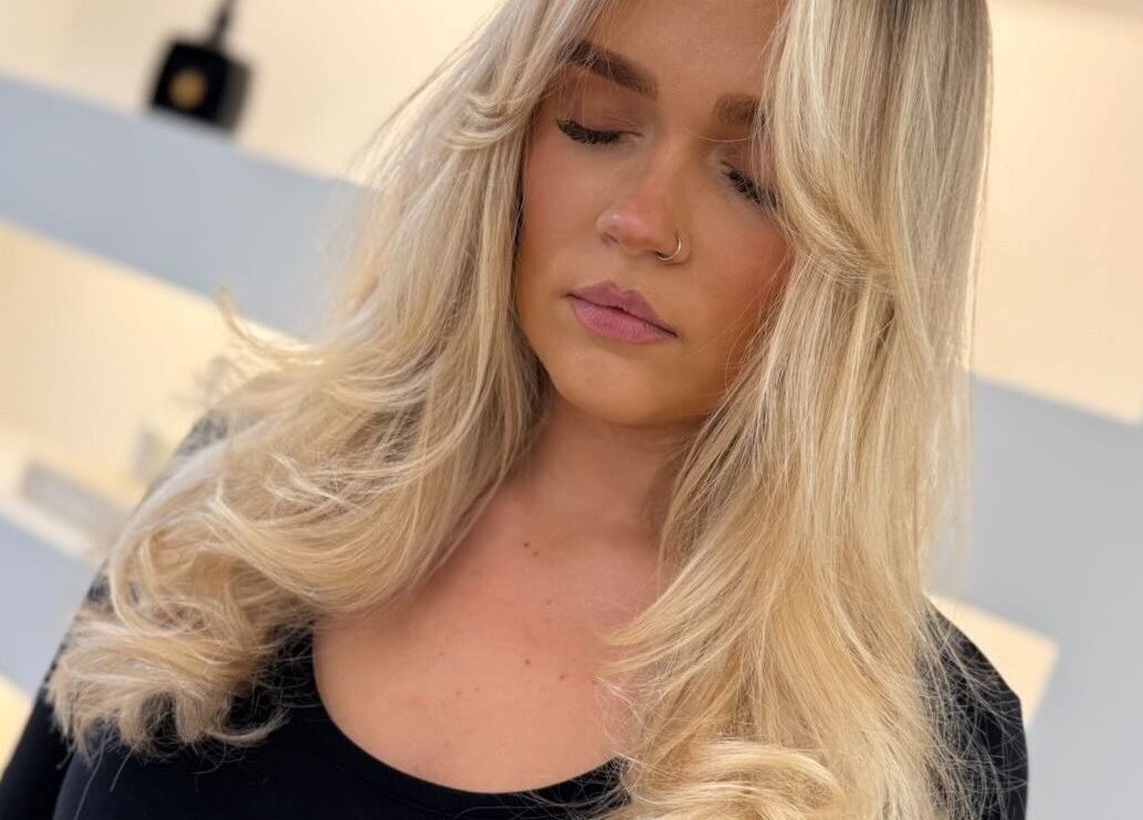 Blonde hair styled elegantly at Studio 22, Ripley, England, GB.