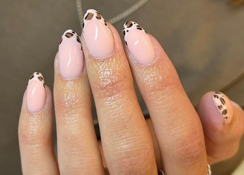 Chic leopard nail art at Studio 22, Ripley, England, GB, showcasing elegant manicure design.